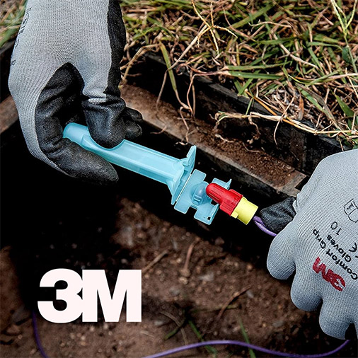 Close up view of gloved hands installing 3M Direct Bury Splice. The 3M logo is overlayed over the image.